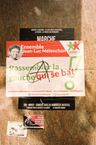 A poster on a wall in Paris promotes a march against racism, police violence, the mafia, and migrant hunting, organized by Ensemble Insoumis with Jean-Luc Mélenchon. There's a slogan "Rassembler la gauche qui se bat," contact info, social media handles, and event details as part of their campagne.