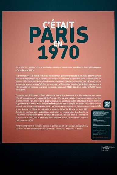 A sign with French text introduces a Paris 1970 photo exhibition at the Bibliothèque historique. It has a large title, event details, description, and a QR code. The background is red with black and white text.